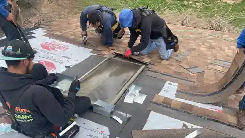 New roof being sealed in Flower Mound HOA community near FM 1171